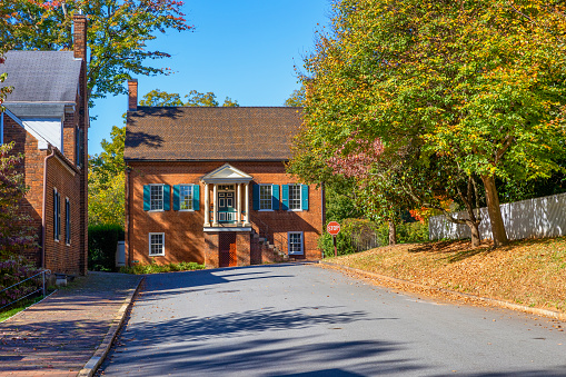Old Salem, North Carolina, USA - October 26, 2023: Street view of an old home in this historical town