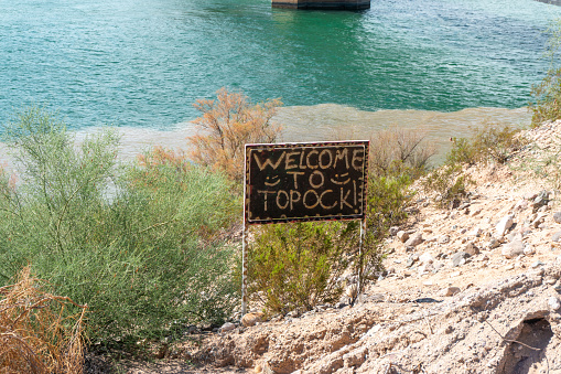 Topock, Arizona, United States - 1 October 2016:  Welcome to Topock sign near Colorado River.