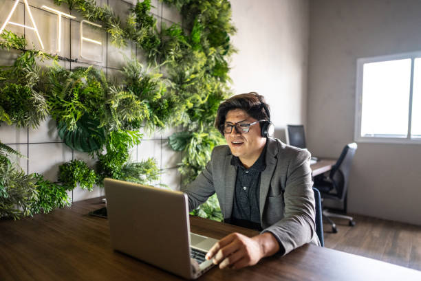 istock Mature man in remote business meeting at work 1940296233
