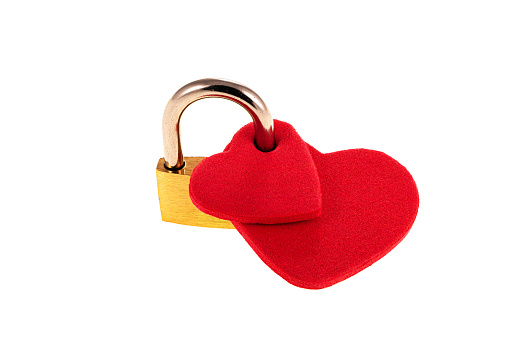 A padlock as an alliance of two red hearts. Concept of marriage and eternal union.