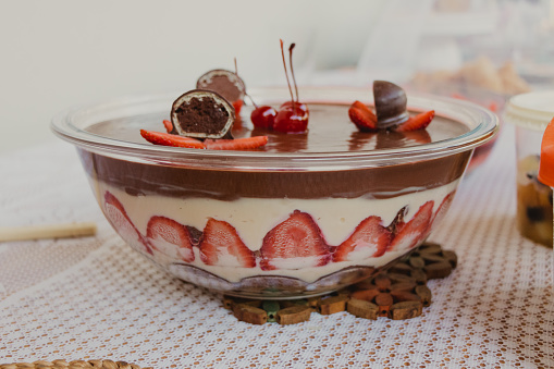 layered dessert of cream with strawberry and chocolate