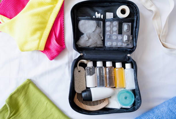 istock Travel cosmetics kit on bed , top view 1940373070