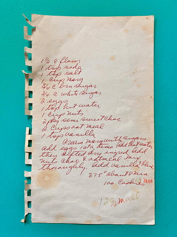 Old stained chocolate chip recipe handwritten on paper