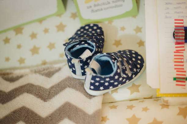 Tiny blue shoes stock photo