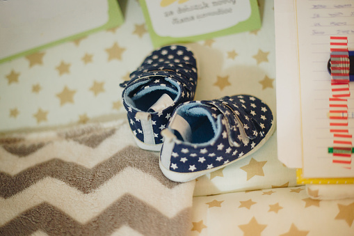 Tiny blue shoes stock photo