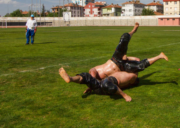 KARAMAN,Türkiye - May 10, 2017: Unidentified oil wrestlers at the Oil Wrestling Festival. Wrestlers oil their bodies and start wrestling.