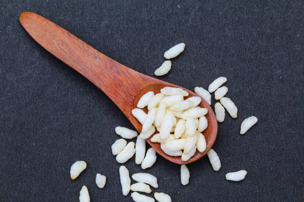 Puffed rice in a wooden spoon top view