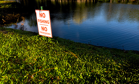 Close up no fishing and no trespassing sign in Florida