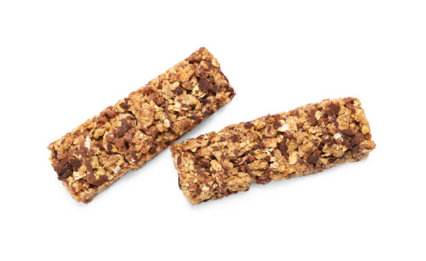 istock Two tasty granola bars isolated on white, top view 1940396516