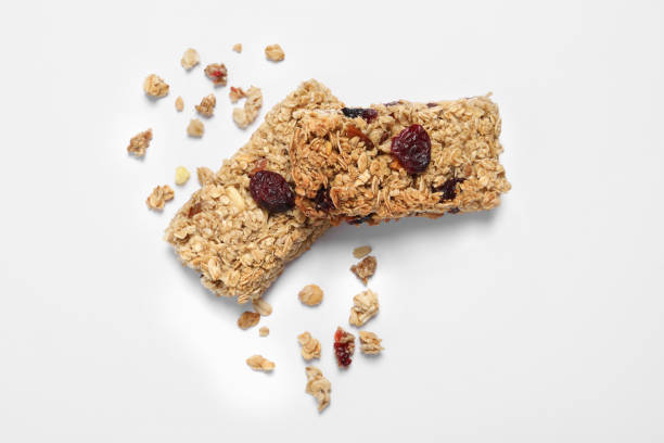 istock Tasty granola bars on white background, top view 1940409760