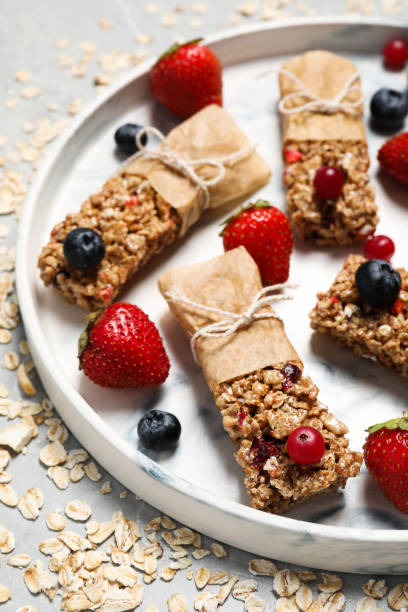 istock Tasty granola bars and ingredients on light table 1940410268