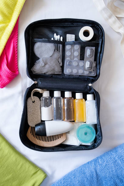 istock Travel cosmetics kit on bed , top view 1940421225