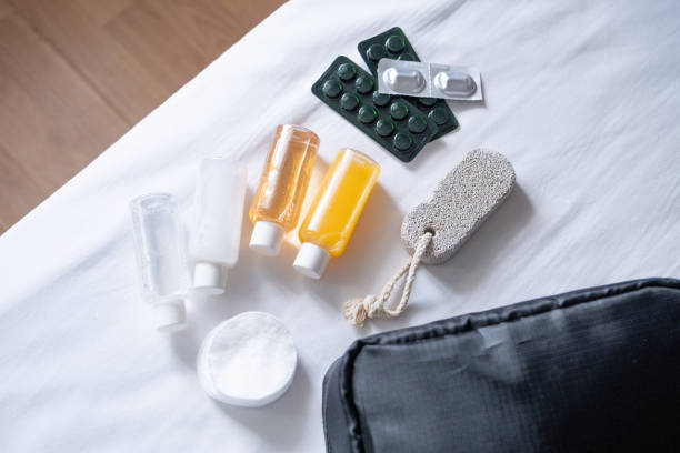 istock Travel cosmetics kit on bed , top view 1940423922