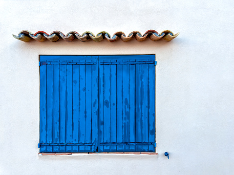 Close up window with shutter from old house in St Tropez, France