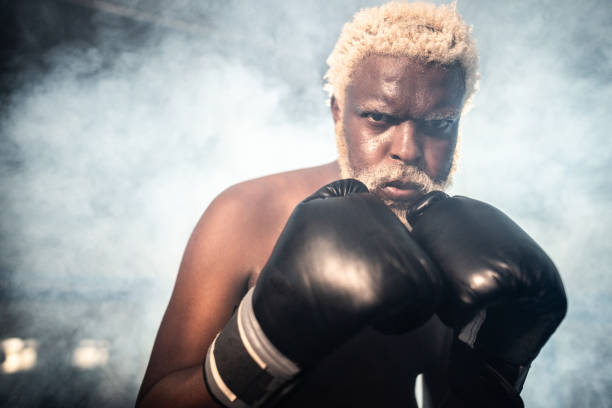 istock Portrait of a boxer man fighting on a boxing ring 1940463630