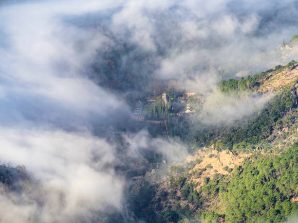Monastery in the Batuecas Valley, Sierra de Francia, with fog between the mountains