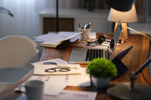 Modern work table with computer laptop and cityscapes view from window.Business concepts ideas