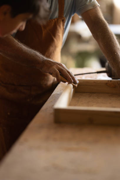 Grandfather and grandson in workshop