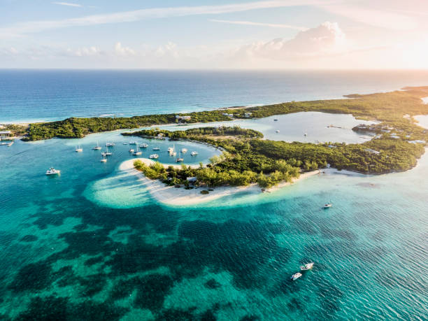 Beautiful Aerial View of Famous Chat'n'chill Conch bar in Stocking Island (Exuma - Bahamas) near George Town with many boats and Sailing Yachts Anchored