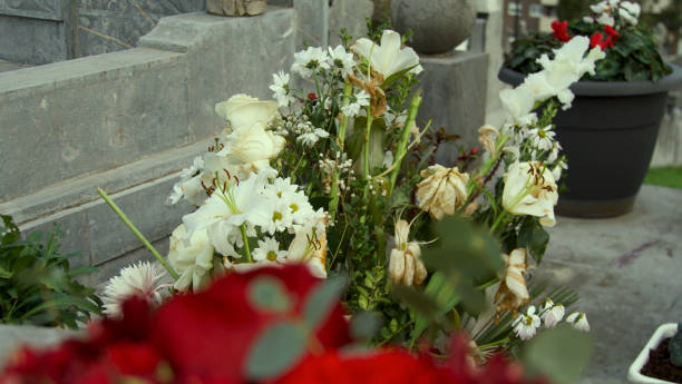 istock Various types of white flowers as a tribute in a pantheon 1940522520