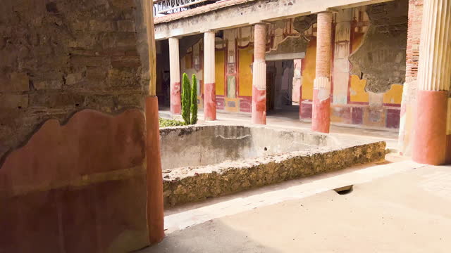 Colorful frescoes in the interior courtyard of Pompeii