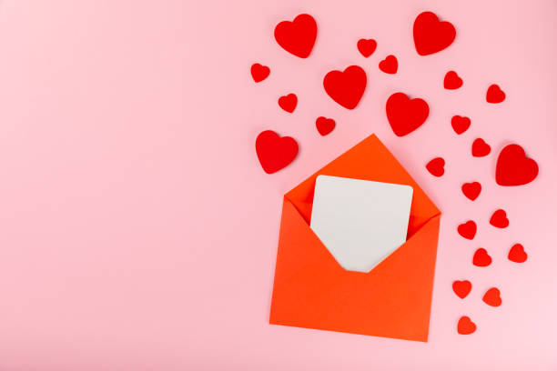 istock Valentine's Day concept. Valentine's Day background. Gifts, candles, confetti, envelope - postcard on background. Flatley, top view, copy space.Valentine's day celebration 1940536716