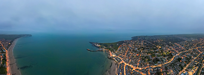 Aerial night view of the famous travel destination, Swanage, Dorset, South West England. blue hour winter, uk