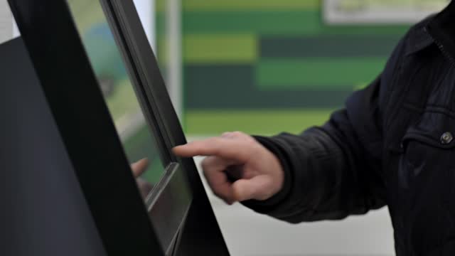 pensioner receives a pension or pays for services using a bank terminal.