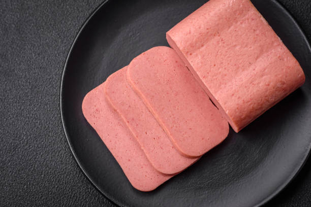 istock Delicious canned pink ham with salt, spices and herbs 1940565151