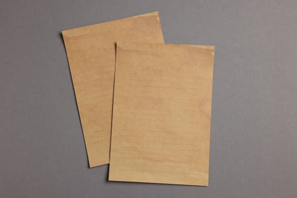 istock Sheets of old parchment paper on grey background, flat lay 1940579254