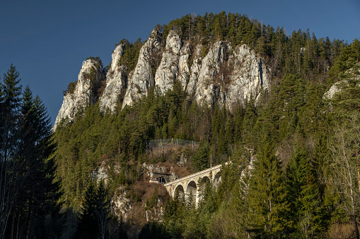 Mountains raiway near Semmering spa town in Austria winter sunny Alps without snow with viaduct