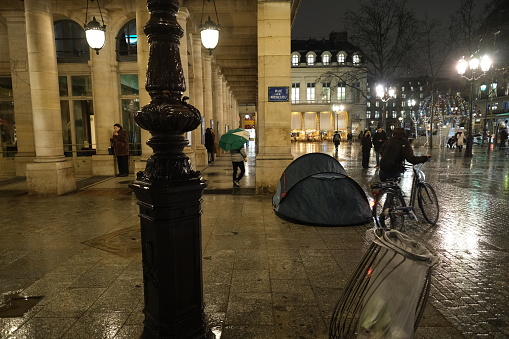 Paris, France - January 17, 2024: A tent of a homeless person in front of a famous theater \