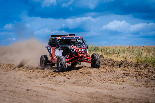 istock UTV buggy and 4x4 offroad in sandy track. Rally extreme riding 1940656875
