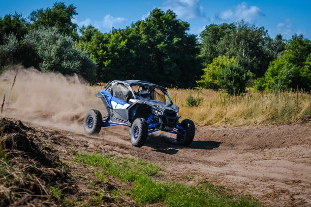 istock ATV and UTV riding in sandy dusty track. Amateur competitions. 4x4. 1940657384