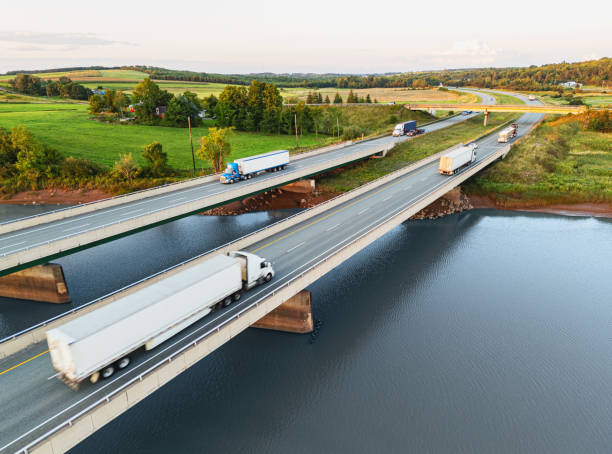 istock Semi Trucks Crossing River 1940717130