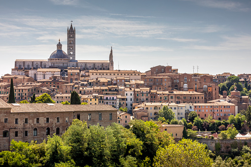 Siena, Italy - July 26, 2023: The cityscape of Siena, in the hearth of Tuscany