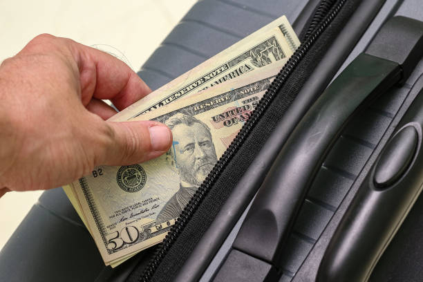 istock View of hand holding US dollar banknotes 1940785820