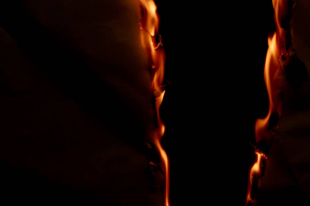 istock burning paper, glowing edge of paper 1940786894
