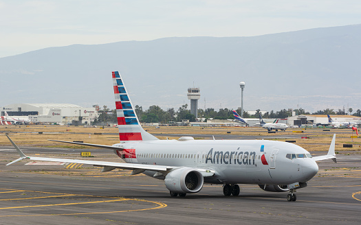 Ciudad de Mexico, Mexico – January 14, 2024: An American Airlines aircraft taxiing on a sunny runway