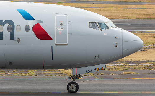 Ciudad de Mexico, Mexico – January 14, 2024: An American Airlines aircraft taxiing on a sunny runway
