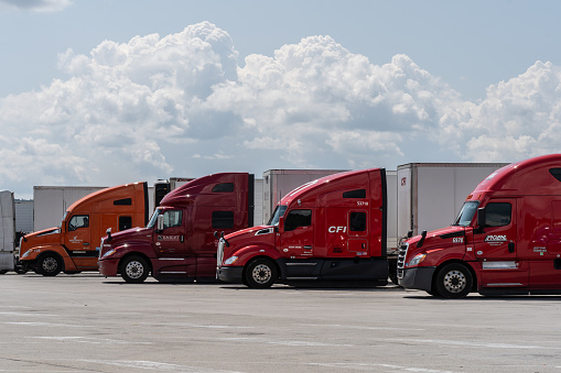 Somerset, Pennsylvania  July 23, 2023: Semi-trucks parked in lot at rest stop on the Pennsylvania Turnpike.