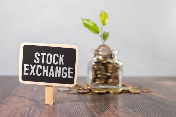 istock stock exchange written on newspaper on keyboard. 1940931357
