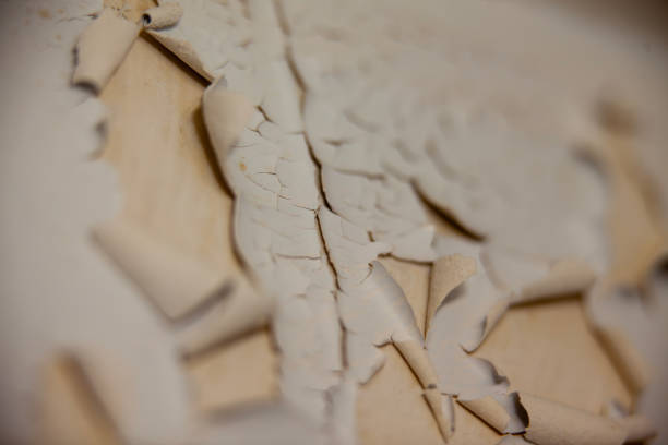 An image of the wrong type of paint on a surface peeling due to moisture and temperature.