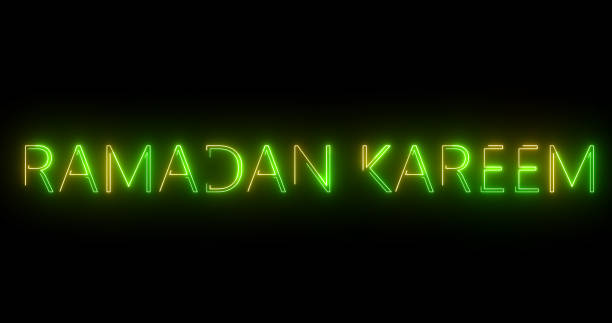 istock Glowing Ramadan Kareem Text animation with neon sign effect. Glittering glowing islamic month of spirituality, hajj background. Elegant neon style glowing Happy Ramadan arabic background. 1940990405