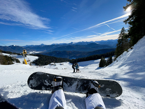 snowboarder enjoying the view of the mountains