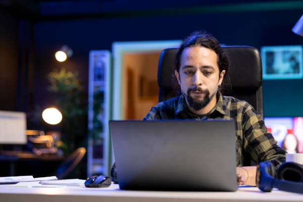 istock Man typing email report on laptop 1941083389