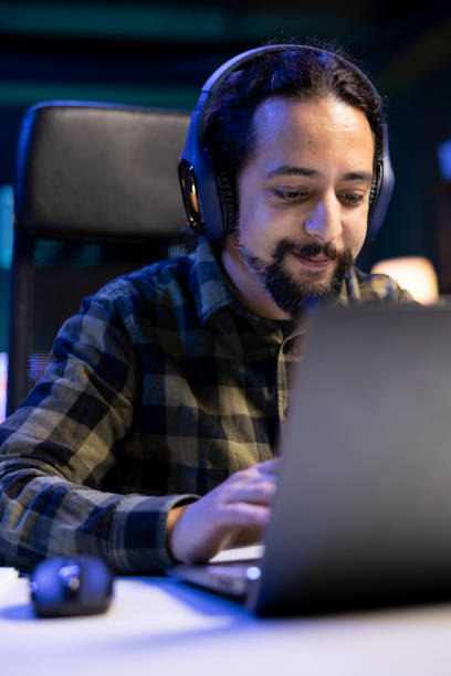 istock Young man wearing wireless headphones 1941084977