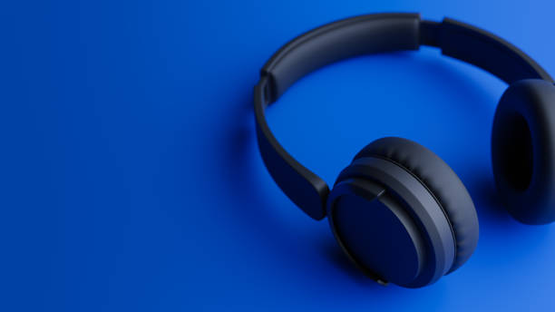 istock Black wireless headphones concept background on blue background,3d rendering 1941171811