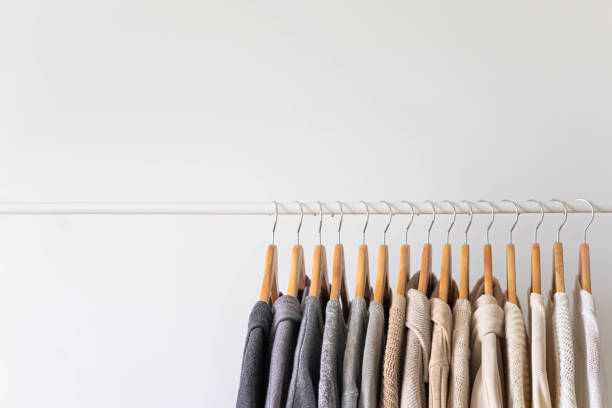 istock Hanger with neutral beige and white clothes on a white background. 1941245214