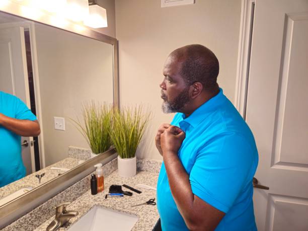 istock Black Male Buttoning Shirt 1941262293